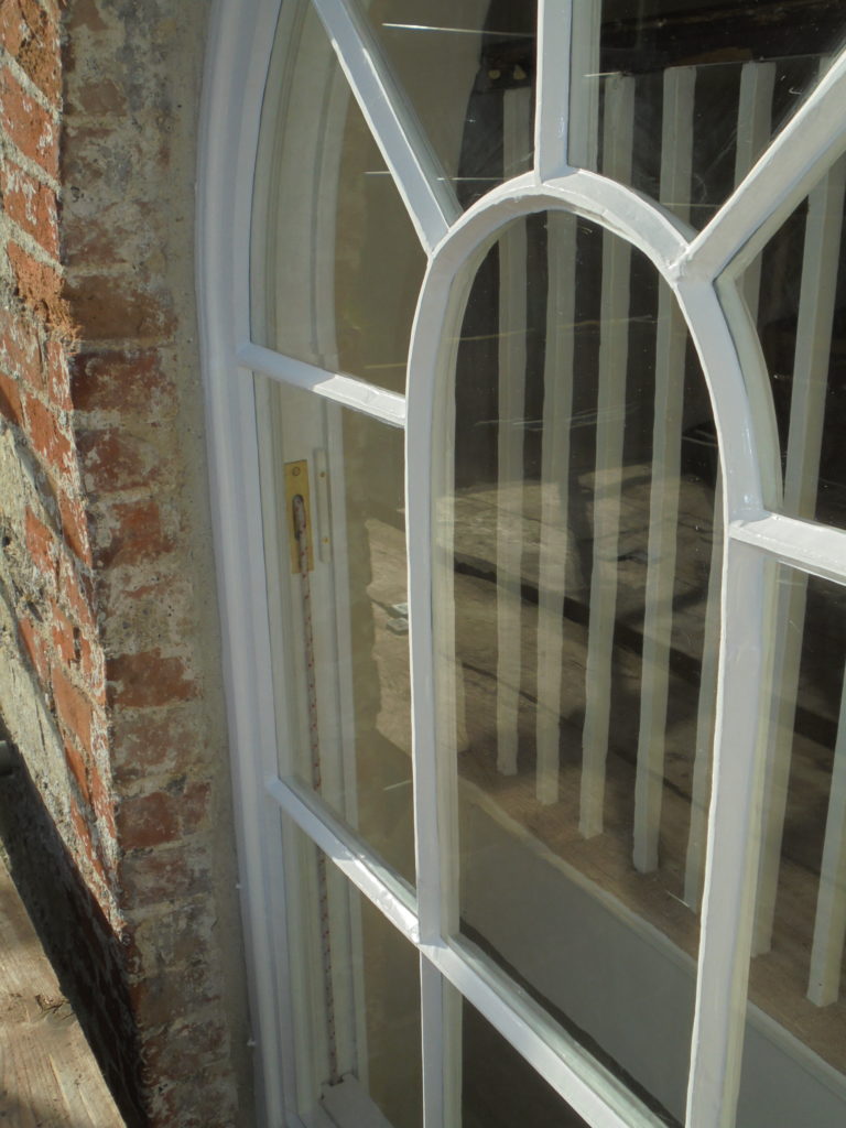 Timber Window Conservation - wood framed arch sash window in a listed building restored and redecorated