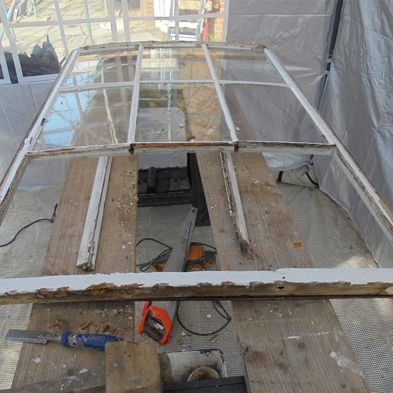 Timber Window Repairs - Wood frame window being dismantled for repair and redecoration