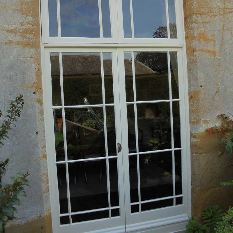 Timber Window Conservation - wood framed doors in a listed building beautifully restored