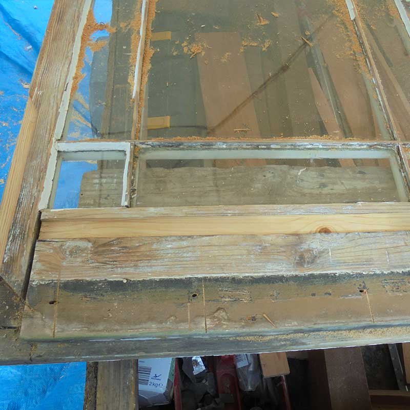 Timber Window Conservation - Wood frame door removed for repair