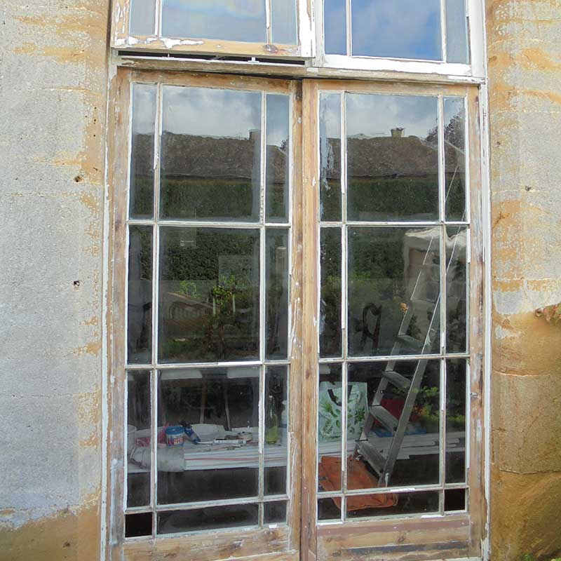 Timber Window Restoration - Wood framed doors stripped ready for repair and redecoration